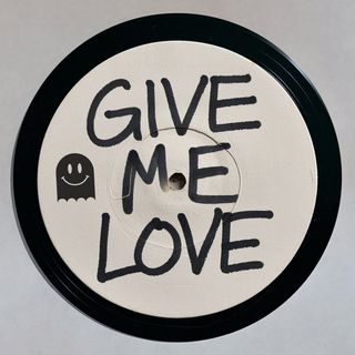 A vinyl white label with the words "Give me love" scrawled on it in marker.